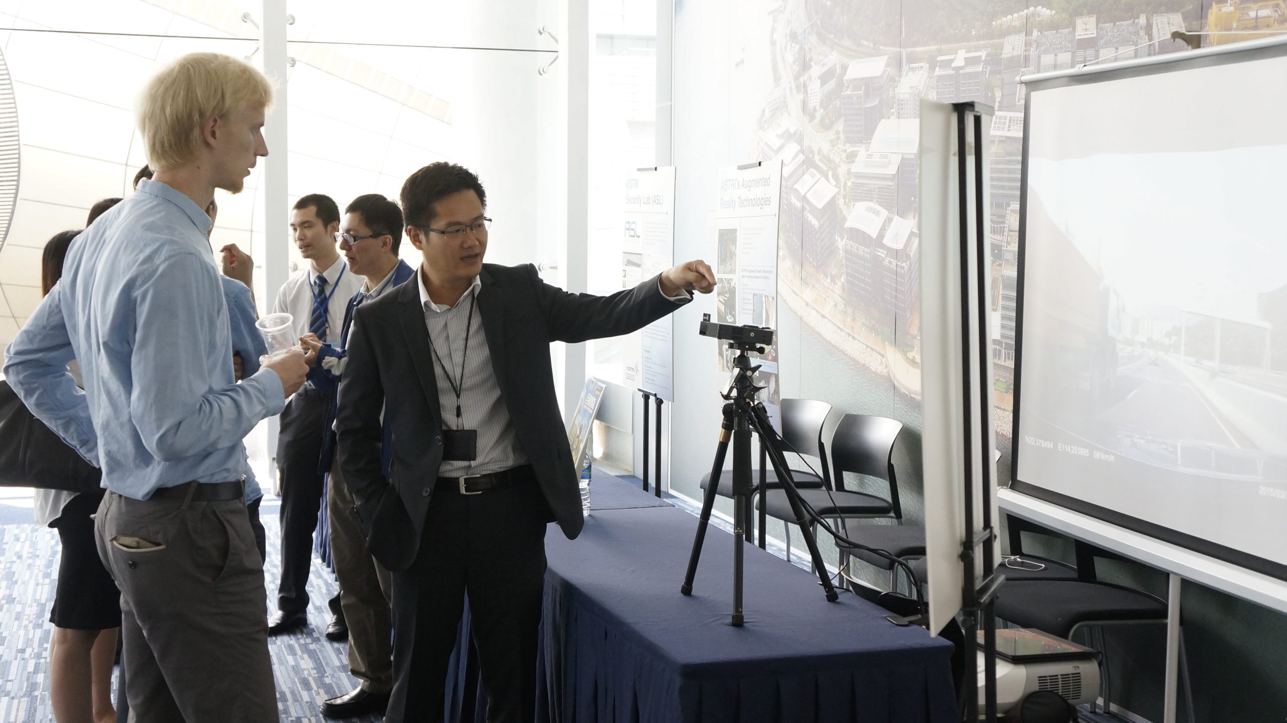 A demonstration of head up display (HUD) parts and technology developed by ASTRI and its industrial partner outside the venue.